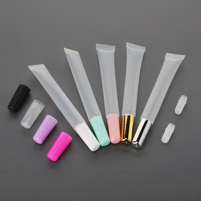 China 10ml 15ml Cosmetic Stock Empty Gold Sliver White Pink Cap With Clear Lip Gloss Squeeze Tube Gloss Container With Private Label for sale