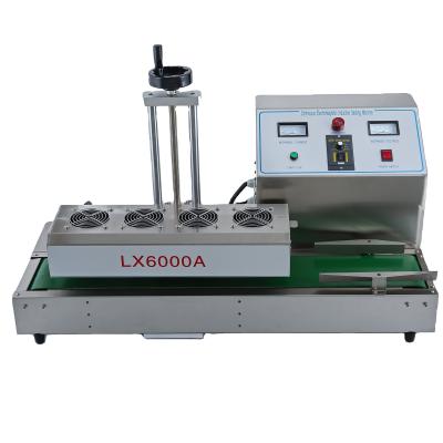 China LX6000A Food Electric Heating Plastic Bag Continuous Induction Sealing Machine for sale