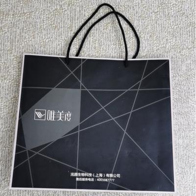 China Biodegradable Custom Eco Friendly Clothing White Paper Shirt Tote Bags With Logo for sale