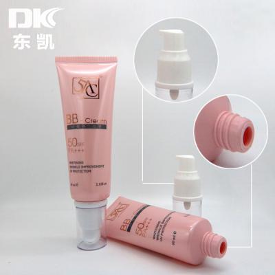 China Environmentally Friendly Multifunctional Orange Pump Tube Makeup Lotion Foundation Sunscreen Makeup Free Plastic Tube Color Cosmetic for sale