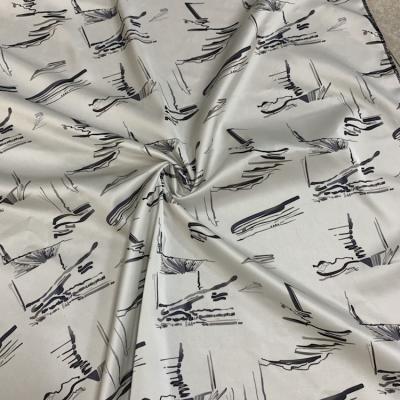 China Solids Black White Fashion Polyester Pattern Printed Acetate Raw Silk Soft Fabric for sale