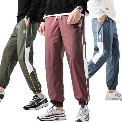 China 100% Reflective Calca Moletom KEROSENE KEROSENE Polyester Fabric Rainbow Oversized Pants 100% Track Pants Men's Street Fashion for sale