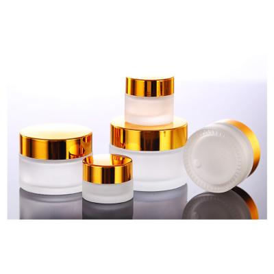 China Luxury 1oz 10ml 30ml 50ml 100ml Skin Care Cream Frosted Round Glass Cosmetic Packaging Container Cream Jar With Gold Lid for sale