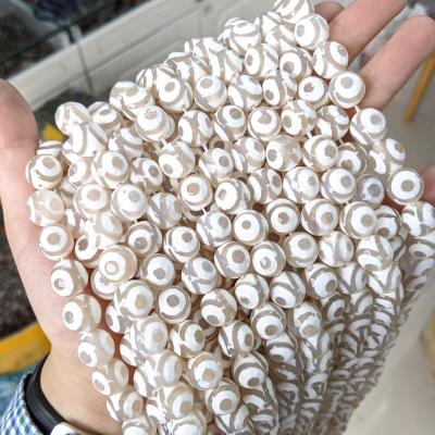 China Beads Strands Wholesale 12mm White Loose Faceted Tri Eye Three Eye Pattern Dzi Tibetan Beads for sale