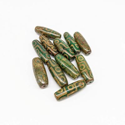 China 9 Eyes Tibetan Dzi Pattern New Green Tibetan Eye Agate Bead Wholesale 40mm 15mm Long Bucket Tibet Dzi Bead For Jewelry Making for sale