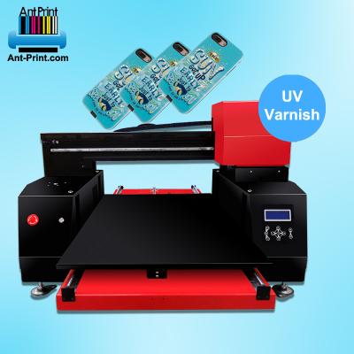 China Best Hotel Phone UV Printer 6090 Special Case UV Printer For UV Varnish Printing With 3 Print Head for sale