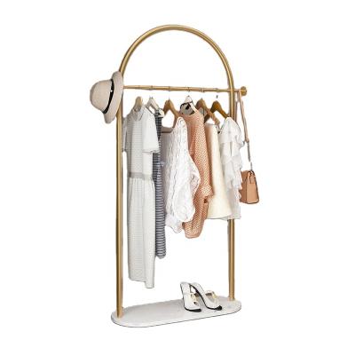 China (Other) Wholesale Adjustable Gold Clothing Display Rack Boutique Clothing Racks Base Stainless Steel Metal Clothing Rack Marble Display for sale