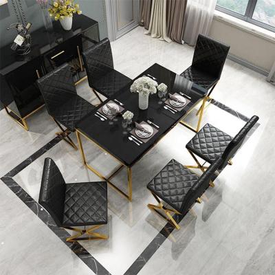 China Modern made in porcelain stainless steel dining table designs with tempered glass top for sale