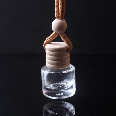 China Perfume Bottle 5ml Cylinder Shape Empty Perfume Bottles Glass Bottle Pendant For Car Mini Perfume for sale