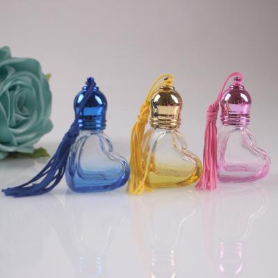 China New Type Daily Necessities 5ml Heart Shape Glass Material Empty Bottle Vials Colorful Essential Oil Roll On Bottle For Perfume for sale