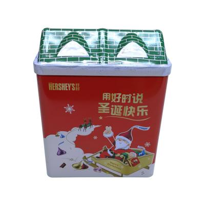 China Recycled Materials House Shaped Christmas Milk Chocolate Packing Empty Tin Box Christmas House Tin Metal Christmas Cookies Tin Case for sale