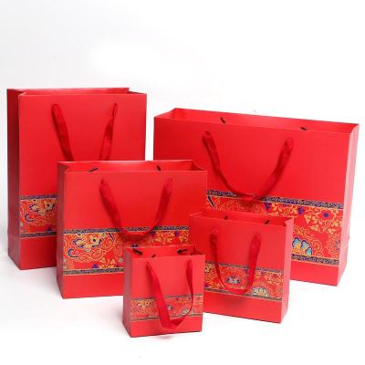 China Recycled Materials Printing Cheap Elegant Paper Bag With Your Own Logo for sale