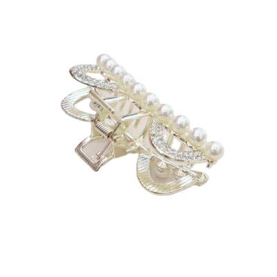 China Japan style Japanese back hair ponytail hair clip French and Korean stylish and simple pearl temperament pan hair clip shark hair clip for sale