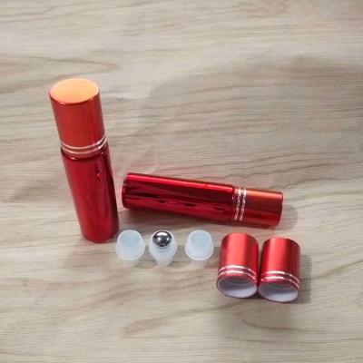 China Custom size red painted perfume essential oil roller glass bottles with cap for sale