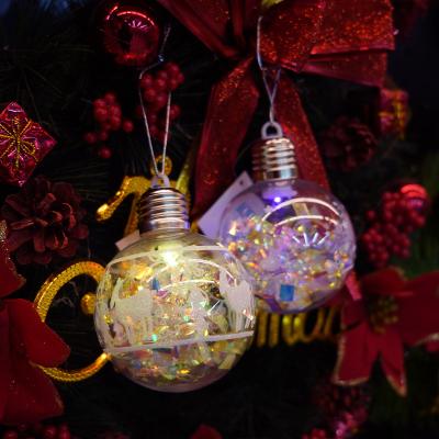 China Fashion Christmas custom decoration festival substance LED bulb shape transparent sequin ribbon glow Christmas ball ornaments for sale