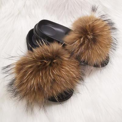 China Anti-Smell Raccoon Fur Slippers Fully Fur Slides For Women And Kids for sale