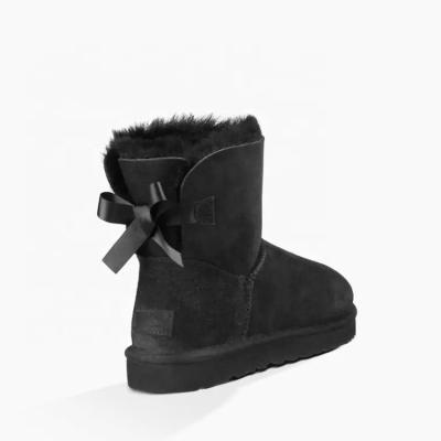 China Anti-odor Fashion Winter Hairy Women Warm Fur Scratching Sliver Bows Lady Sheepskin Boots for sale