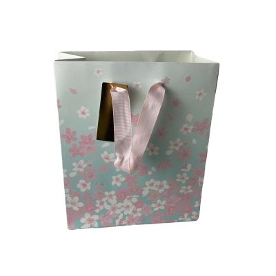 China Beautiful China Recyclable Wholesale Paper Bag With Handles for sale