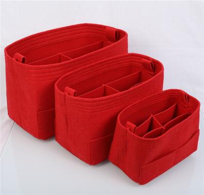 China New Eco-friendly Design Felt Bag Cosmetic Bag Fashion Organizer Felt Insert Bag for sale