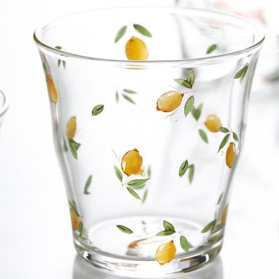 China Viable Creative Hand Pinch Grain Lemon Mouth Slanted Drinking Glass for sale