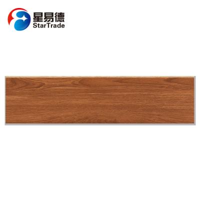 China Elegant villa floor wall waterproof wood grain ceramic tile en venta