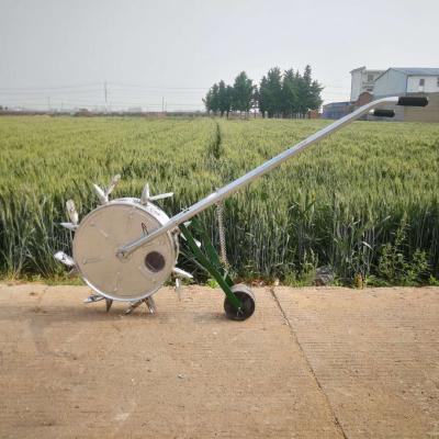 China Corn/maize/soybean hand push seeder/grain/vegetable seeder with big wheels for sale