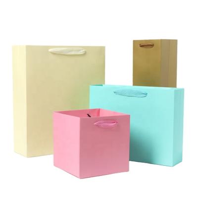 China Clothing Paper Shoes Carry Out Bag Luxury Gift Disposable Handled Shopping Paper Bags For Packaging for sale