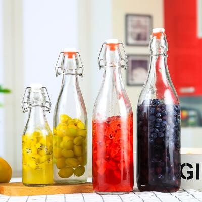 China Bottle For Clear 250ml 500ml 750ml 1000ml Bordeaux Wine Flat Bottom Swing Top Lid Beverage Beer Glass Wine Bottle With Caps for sale