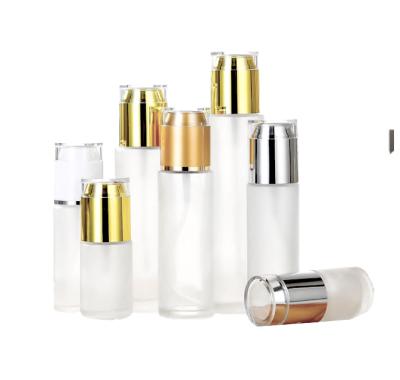 China New cosmetic pump head pressed transparent bottle column 30ml essence bottle glass cosmetic bottle for sale