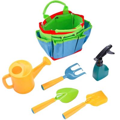 China Modern spot children's sea costume planting vegetables and lifting garden art shovel beach clam shell digging small shovel flo for sale