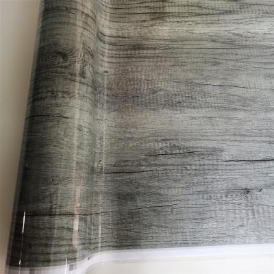 China PVC decorative film with a deep embossed wood grain effect, suitable for lamination processes. for sale