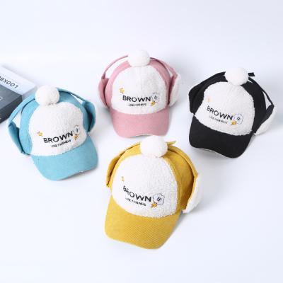 China Character 2-7 years old boy girl earflap kids funky hats cover kids winter logo faux fur winter hat for sale