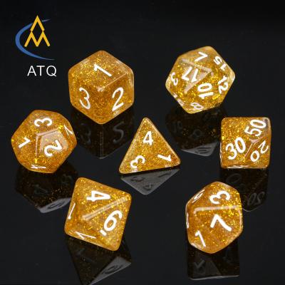 China Luxury Wholesale High Quality Polyhedral Resin RPG Dice Board Game DND Set Core Covered Golden Dies for sale