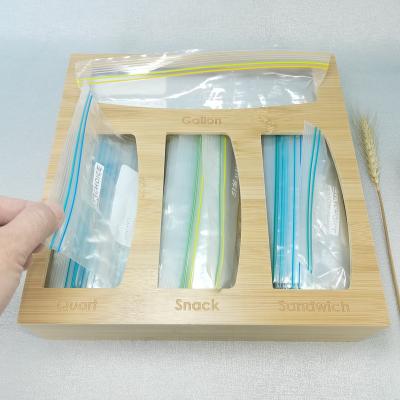 China Drawer Wooden Bamboo Kitchen Rack Bag Holder Freshness Storage Custom Food Bag Storage Box Ziplock Dispenser for sale