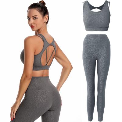 China Breathable Women Fashion Wear OEM Yoga Stock Quantity Customized Embossed Polyester Spandex Sport Suits for sale