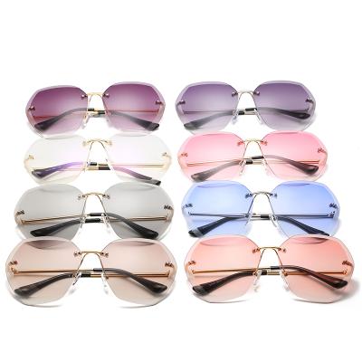 China Fashion Sunglasses Wholesale Custom Rimless Women's GOLD UNISEX Silver UV400 Fashion Metal PC Lens Sun Glasses for sale