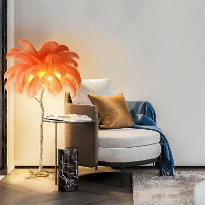 China Hotel handmade living room modern luxury design standing green ostrich feather palm decoration floor lamp for sale