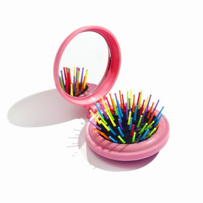 China Waterproof Mini Pink Bow Foldable Comb Hair Scalp Massage Comb Kids Travel Hair Brush With Mirror Makeup for sale