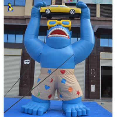 China Advertising Gorilla Balloon Holding Giant PVC Tarpaulin Giant Inflatable A Car for sale