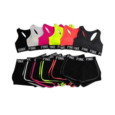 China Seamless PINK sports suits breathable letter pants pink sports bra and running two-piece quick-drying fitness yoga for sale