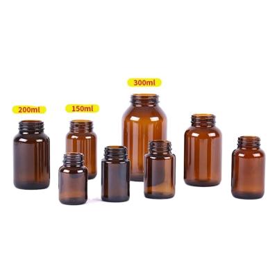 China Cheap Medicine Custom Glass Bottle Packaging Frosted Glass Capsule Bottle With Lid for sale