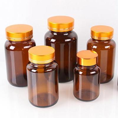 China Medicine Empty Capsule 5 Oz Daze Glass Bottles With Caps Shrink Capsules for sale