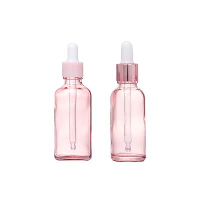 China Rose Color Essential Oil Bottles Glass Dropper Bottle Cosmetic Essence Packaging Bottle With Suction Tube Cover for sale