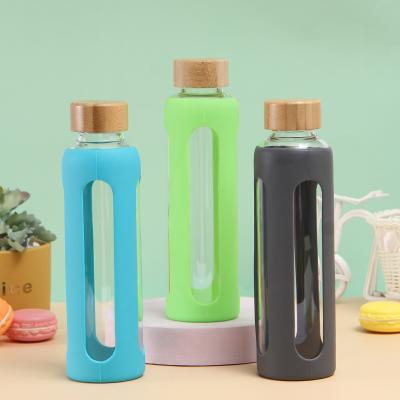 China Sustainable Fashion High Borosilicate Sports Bottle Creative Four Sided Silicone Sleeve Glass Hollow Water Bottle for sale