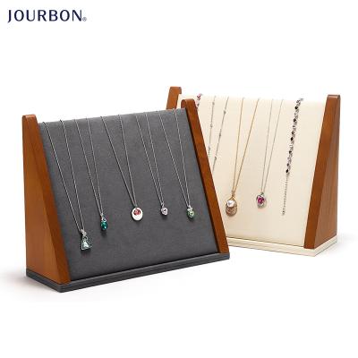 China Jourbon Microfiber Solid Wood Jewelry Necklace Display Stand Windows Jewelry Display Props Jade Necklace Pendant Display Rack for sale