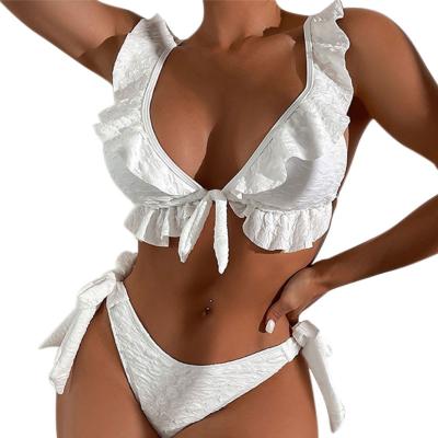 China New European and American swimwear women's breathable solid lace up sexy triangle bikini ruffle fin slit swimwear with chest pads for sale