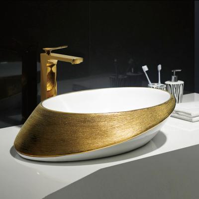 China Gold Face Hand Basin Bowl Bathroom Vanity Vessel Gold Ceramic Rich Modern Luxury Oval Ceramic Rich Sink For Hotel 4star for sale