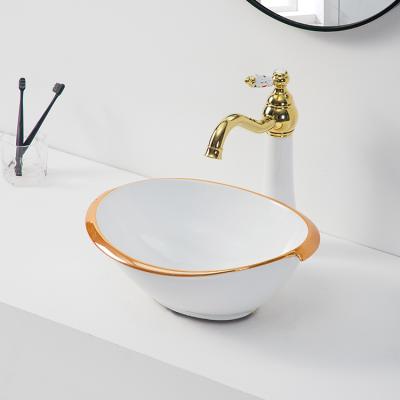 China Ceramic White Above Basin Hotel Modern Counter Top Art Hand Wash Basin Sink Small Bowl With Rose Gold Rim for sale