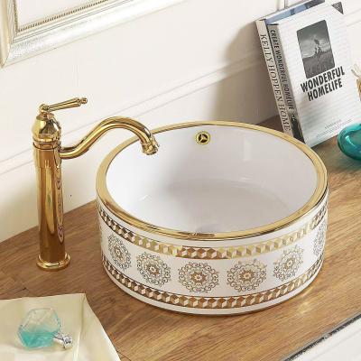 China Hotel Modern Luxury Gold Wash Basin Gold Bathroom Sink Small Ceramic Round Hand Wash Basin for sale