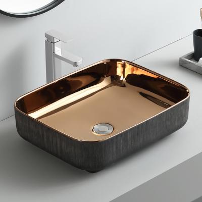 China New Design Modern Unique Ceramic Luxury Black Gold Hand Wash Basin Luxury Bathroom Sink For Hotel for sale